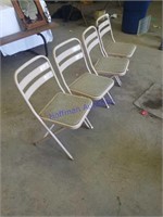 4 metal folding chairs with plastic seats