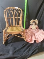Cane bottom child's rocking chair with porcelain