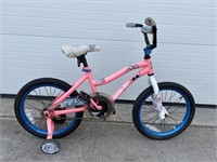 Pink child’s bike with training wheels