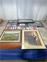 Assortment of framed golf prints, pictures, and