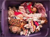 Container of small dolls including Nancy Ann
