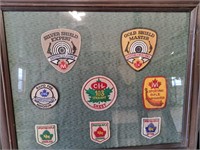 Framed shooting badges