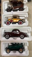 4 model cars in foam boxes. Includes a 1931