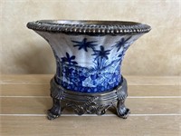 Modern heavy metal base with blue and white bowl