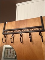 Two door hangers, one in black with spiral pegs