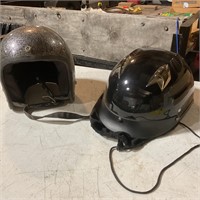 Two motorcycle helmets.