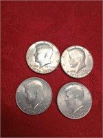 Four bicentennial Kennedy half dollars