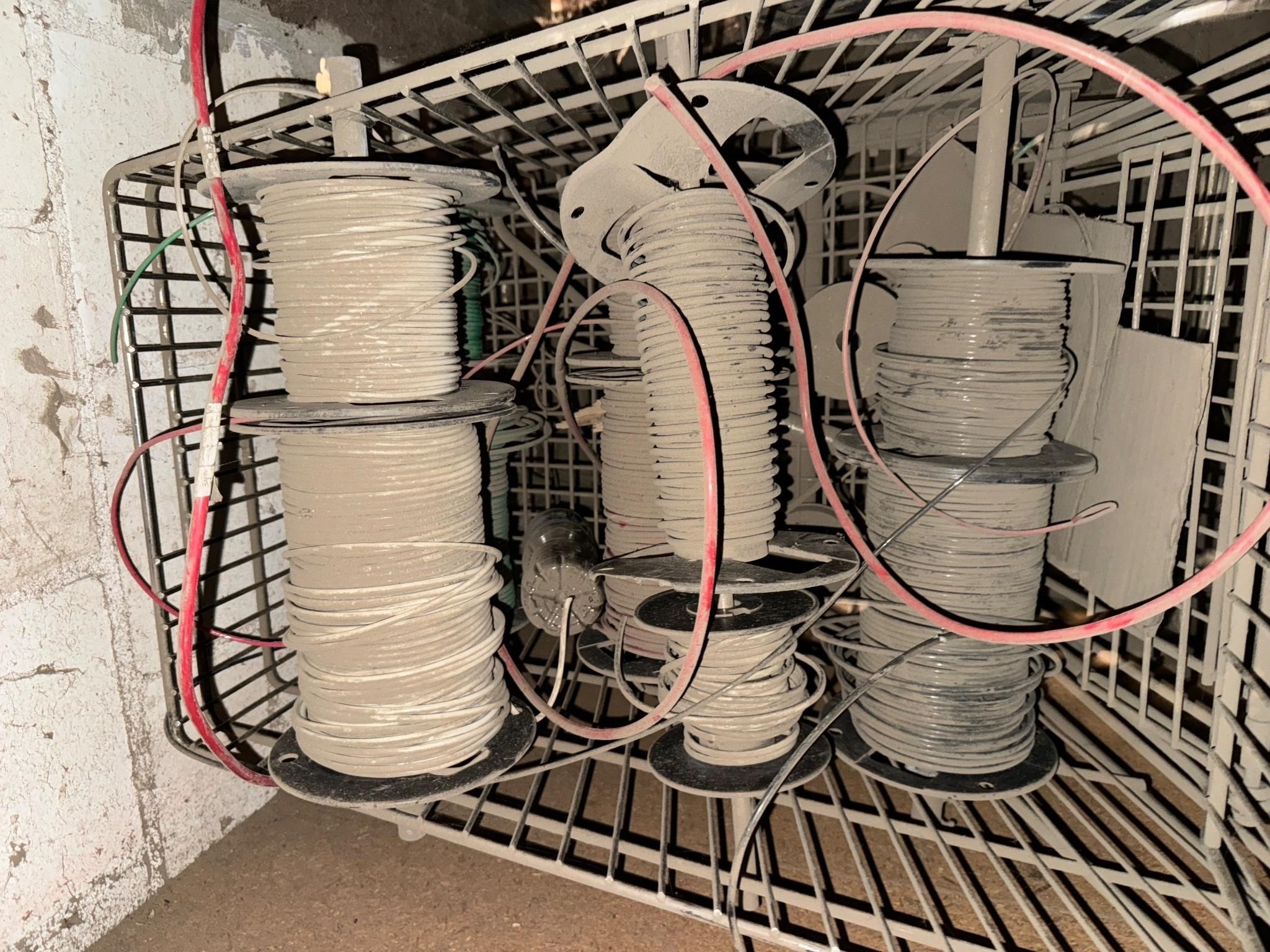 Shopping cart with rolls of wire