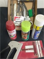 Group of garage items such as paint, staple gun,