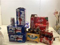 Assortment of Pepsi cans and Coke can