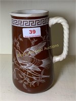Floral and bird decorated pottery pitcher