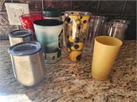 Assorted plastic cups and 2 stainless steel cups