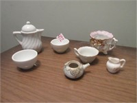 miniature tea set pieces .