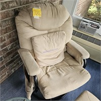 Cream colored swivel rocking chair and footrest