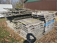 Stack of Wood Fence Panels and Pallets