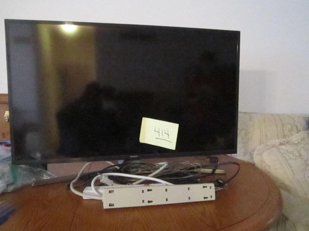 Samsung TV with sound bar and