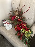 Tote of Christmas flower arrangements and more