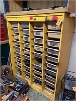 Large tote storage cabinet with many parts tools