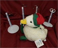 FOUR METAL STANDS AND ONE AFLAC DUCK