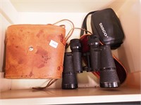 Three pairs of binoculars:  Omega, Tasco and