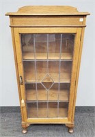 Antique oak small bookcase with leaded door -