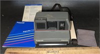 POLAROID CAMERA W/PAPERWORK