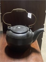 Baker cast iron tea kettle.