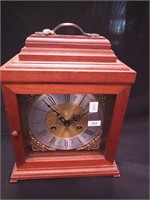 A mahogany striking carriage clock 12" high with