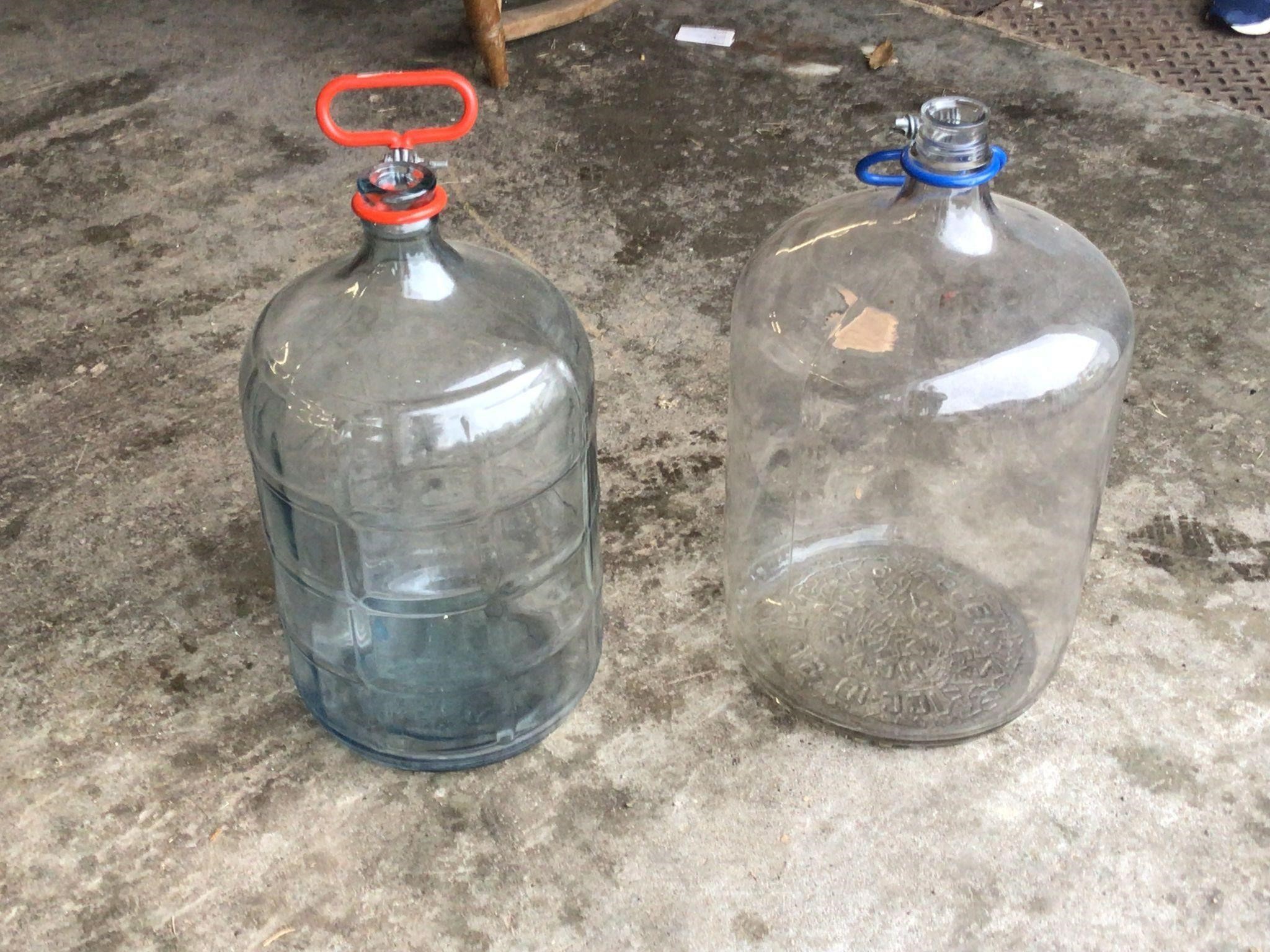 2 LARGE GLASS BOTTLES  NICE SHAPE