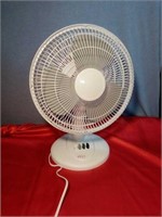 White plastic table fan. Measures approximately