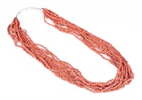 Coral strand necklace.