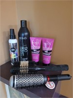 4 unused Redken products and 2 brushes