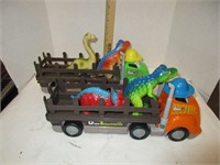 Pair of Dino transporters, and four dinosaurs