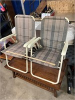 Two folding lawn chairs
