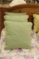 3 green throw pillows