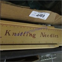 Knitting needles in wood storage box