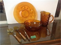 Gold platter, bowl, pitcher, serving utensils