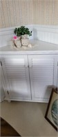 Cute white corner cabinet with shutter style