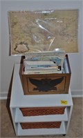 Box with Eagles full of roadmaps, White stand,