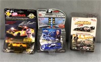 3 racing collectibles new in original packaging