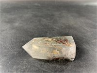 Faceted crystal rock about 3" long with many inclu