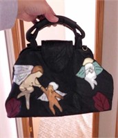 Lee Sands leather purse w/ patchwork cherubs