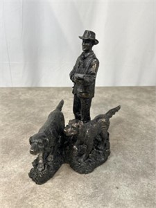 Hunter with dogs sculpture