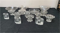 Group of glass candle holders and glass bowls