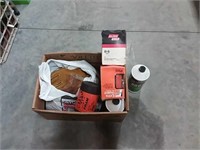 assortment of filters, oil, work gloves
