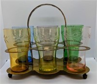 Vintage multi colored glasses in brass caddy