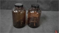 PAIR OF BROWN GLASS JARS