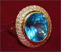18kt London Blue Topaz surrounded by halo of