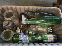 Plastic bin full of vintage bottles