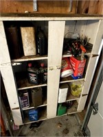Shelf Full Of Mics Oils And Tools.